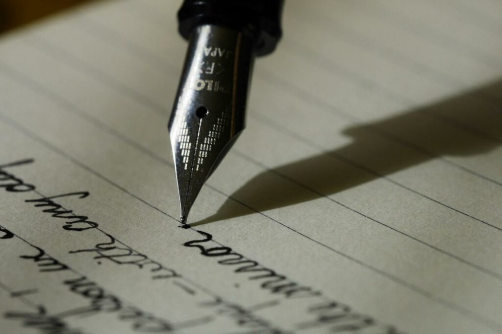 Handwritten note being marked with a pen, illustrating AI for ESL writing corrections used alongside teacher feedback