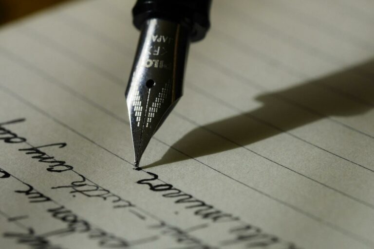 Handwritten note being marked with a pen, illustrating AI for ESL writing corrections used alongside teacher feedback
