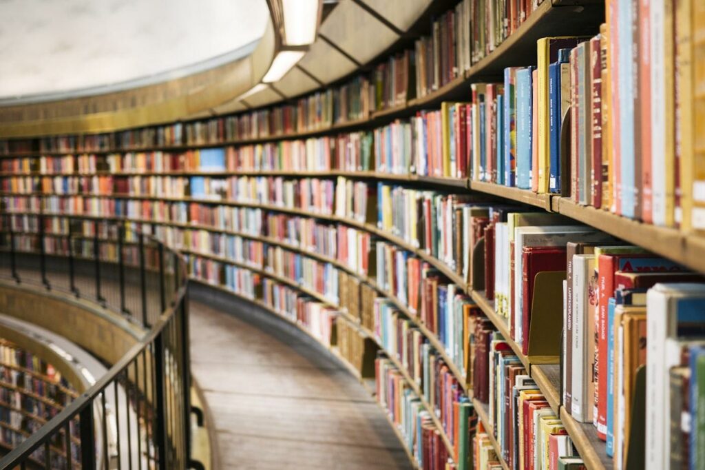 Library bookshelves representing the reading passages teachers use to build AI reading comprehension questions