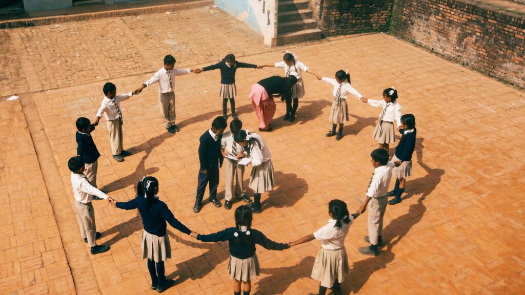 Young children sitting in a circle for an English lesson designed with AI-generated activities