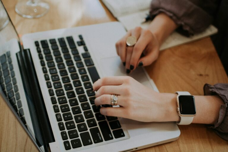 TEFL cover letter draft open on a laptop screen with a coffee cup nearby