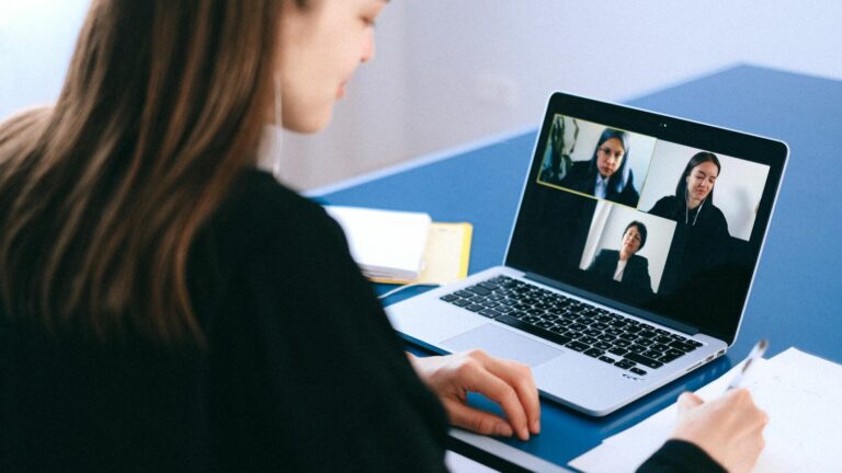 Teacher practicing ai tefl interview preparation on a video call with a laptop