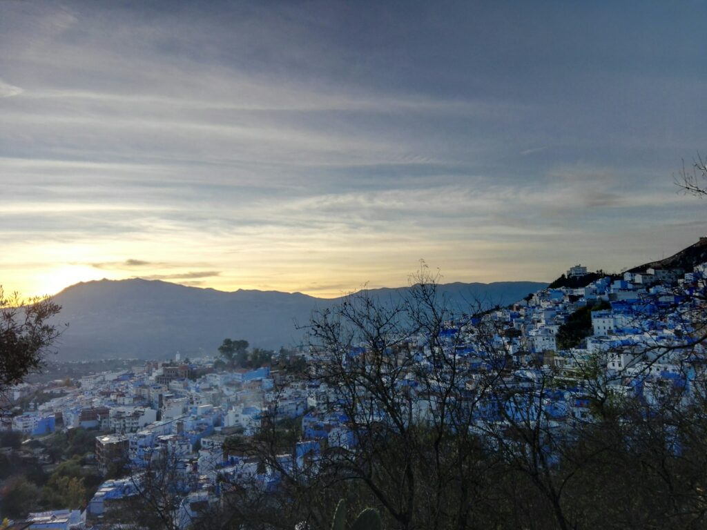 Aerial view of the blue painted houses of Chefchaouen, Morocco, a destination for teachers who teach English in Morocco