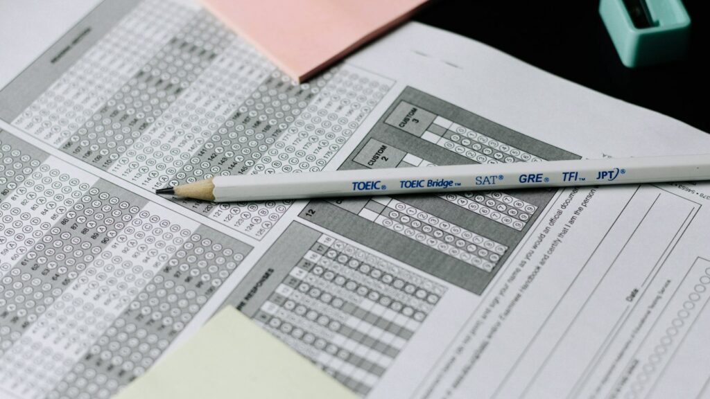 Pencil resting on an answer sheet during IELTS practice and band score testing