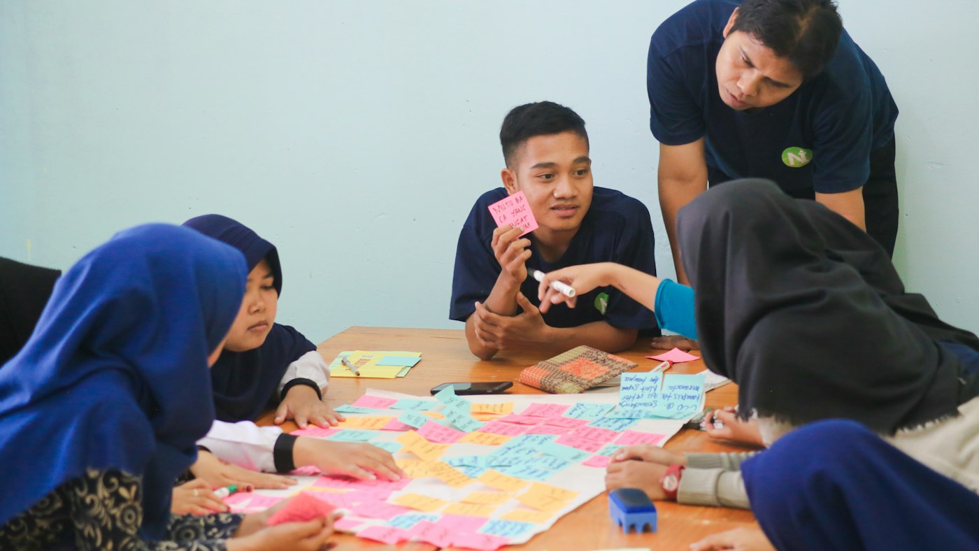 Two students practicing a speaking exercise together as part of an AI speaking partner routine