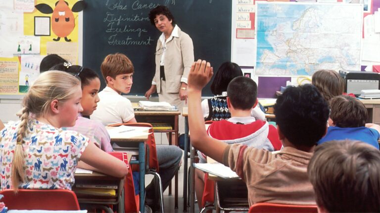 Teacher standing in front of a class while comparing MagicSchool alternatives for English teaching