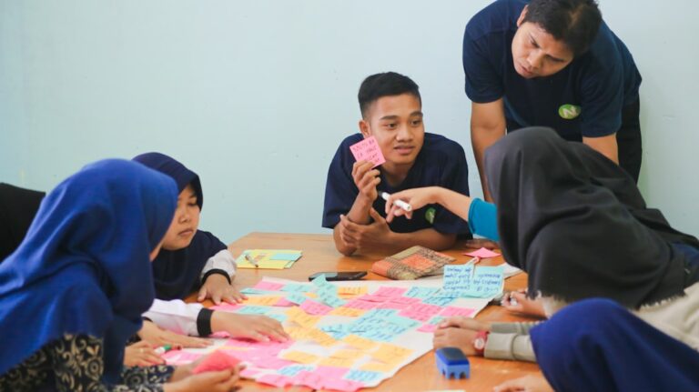 English language learners working out a grammar rule together in a guided discovery task